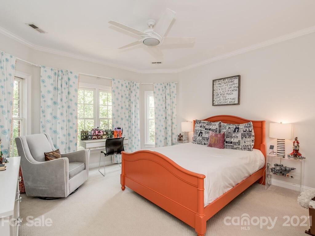 3025 Sharon Road Charlotte, NC 28211 - Photo 22 of 32 a bedroom with a bed and glass window