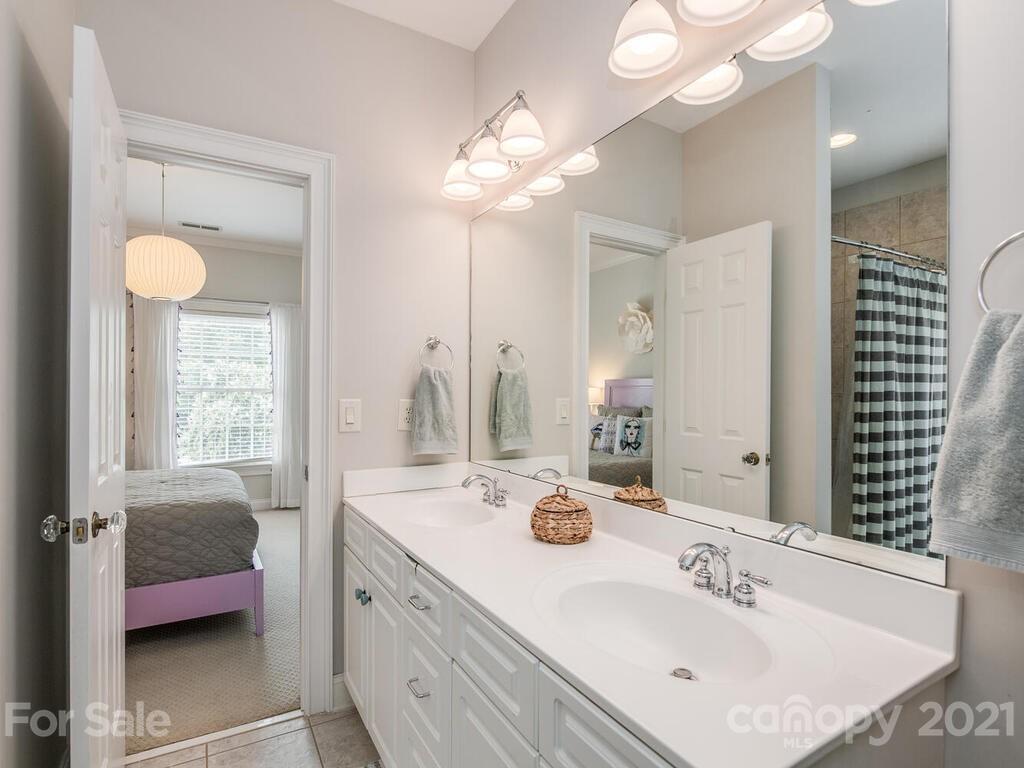 3025 Sharon Road Charlotte, NC 28211 - Photo 23 of 32 a bathroom with a sink and a mirror