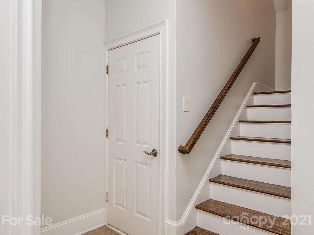 3025 Sharon Road Charlotte, NC 28211 - Photo 26 of 32 a view of staircase with white walls and white door