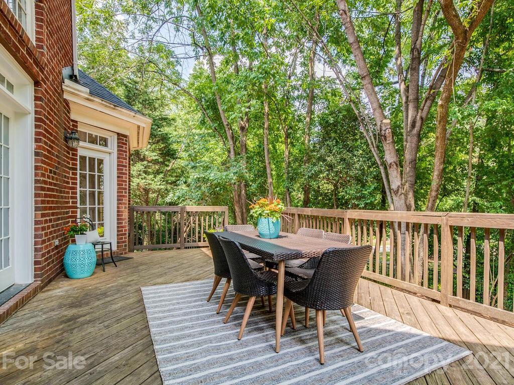 3025 Sharon Road Charlotte, NC 28211 - Photo 27 of 32 a view of a deck with furniture and trees