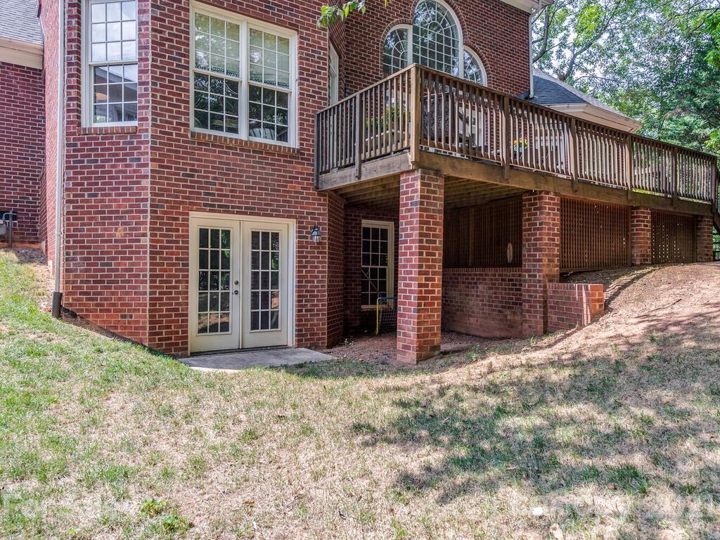3025 Sharon Road Charlotte, NC 28211 - Photo 30 of 32 a view of a house with wooden fence