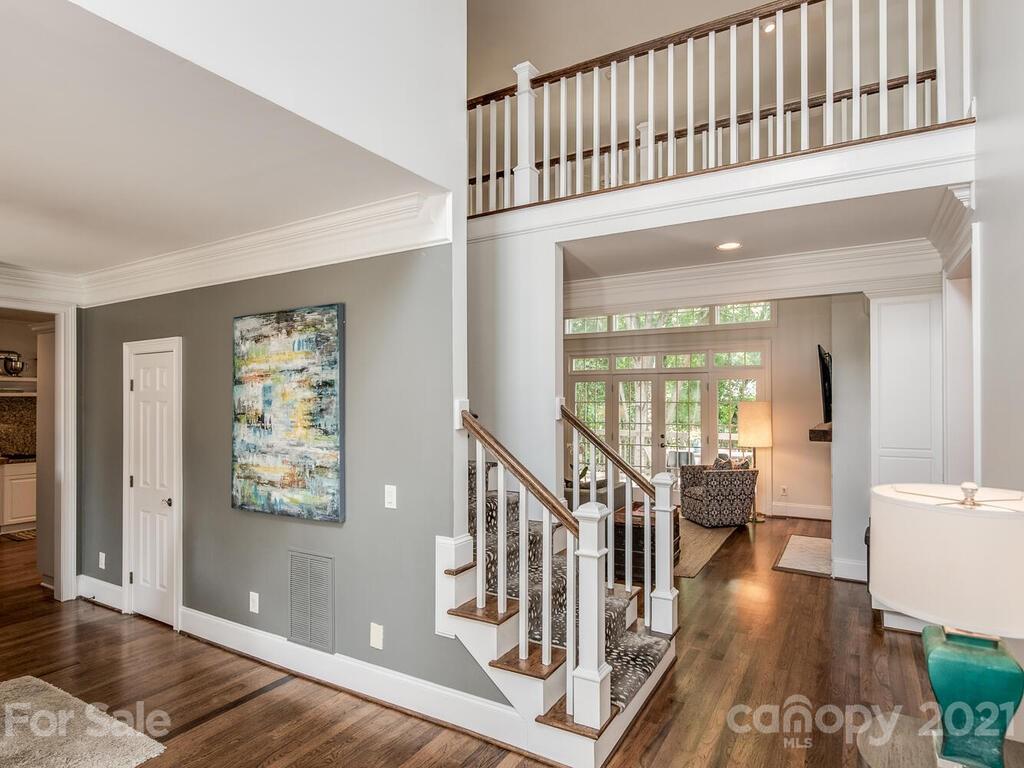 3025 Sharon Road Charlotte, NC 28211 - Photo 5 of 32 a view of an entryway wooden floor and a living room