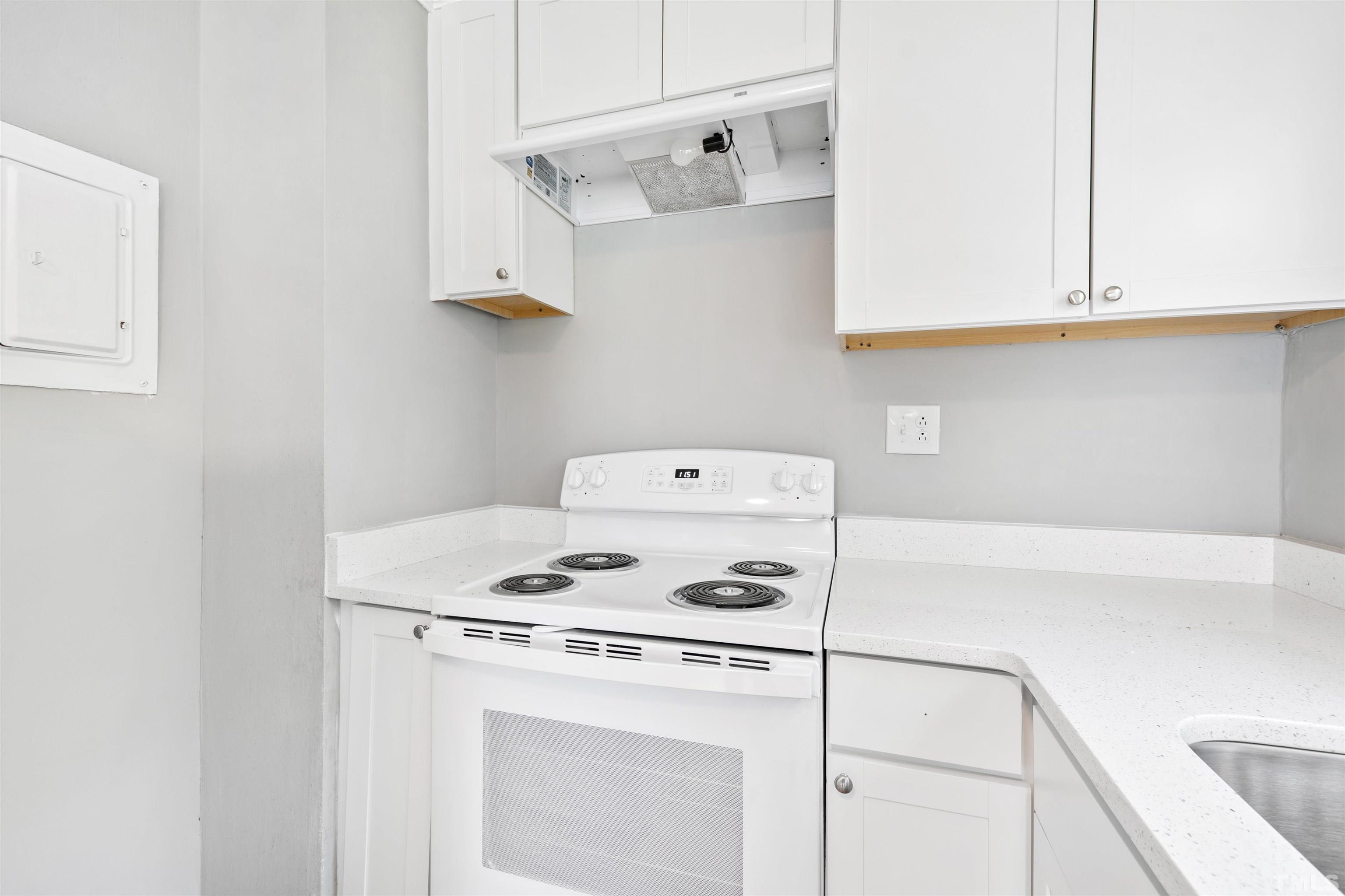 207 Baggett Avenue Raleigh, NC 27604 - Photo 13 of 27 a white stove top oven sitting inside of a kitchen