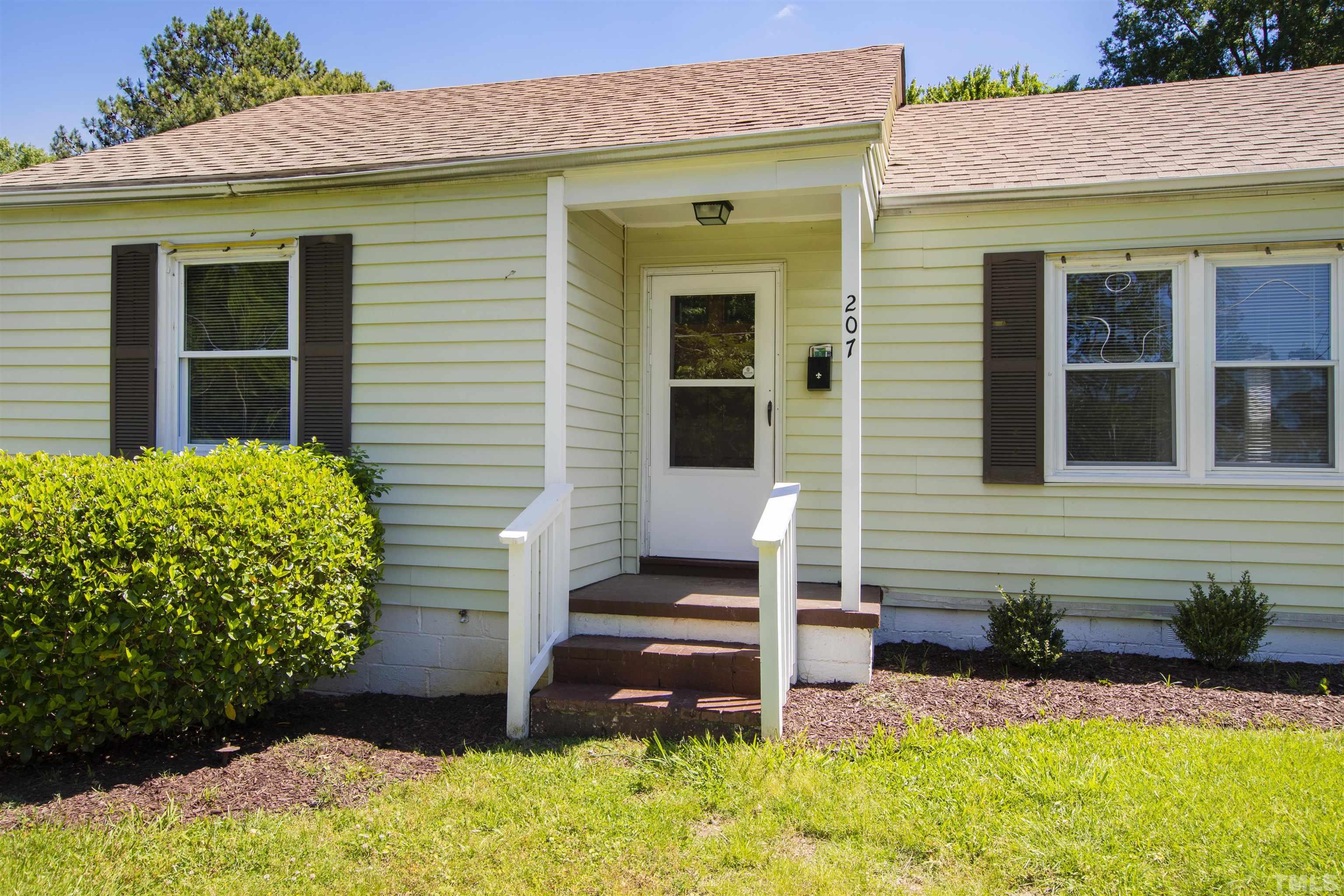 207 Baggett Avenue Raleigh, NC 27604 - Photo 2 of 27 a view of a house with potted plants