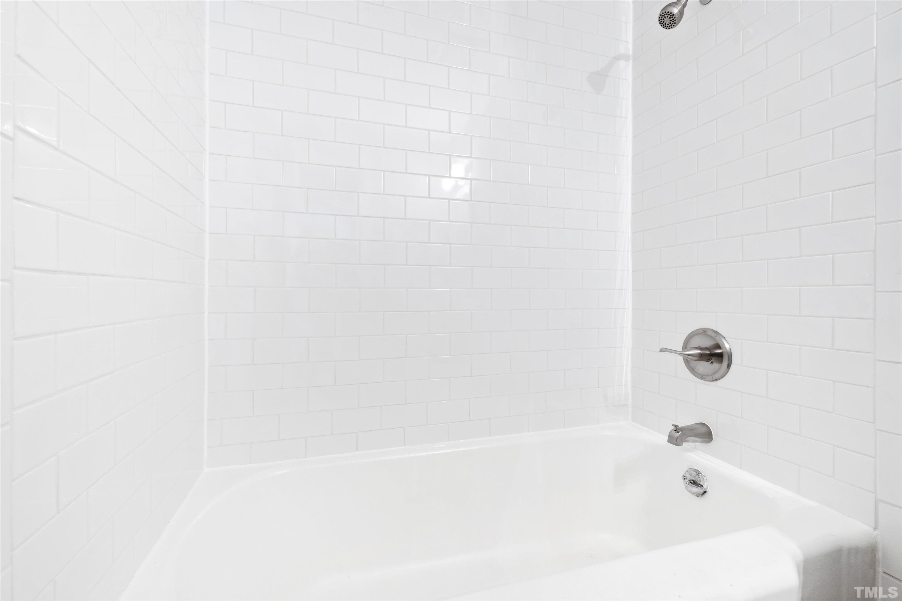 207 Baggett Avenue Raleigh, NC 27604 - Photo 24 of 27 a bathroom with a bathtub