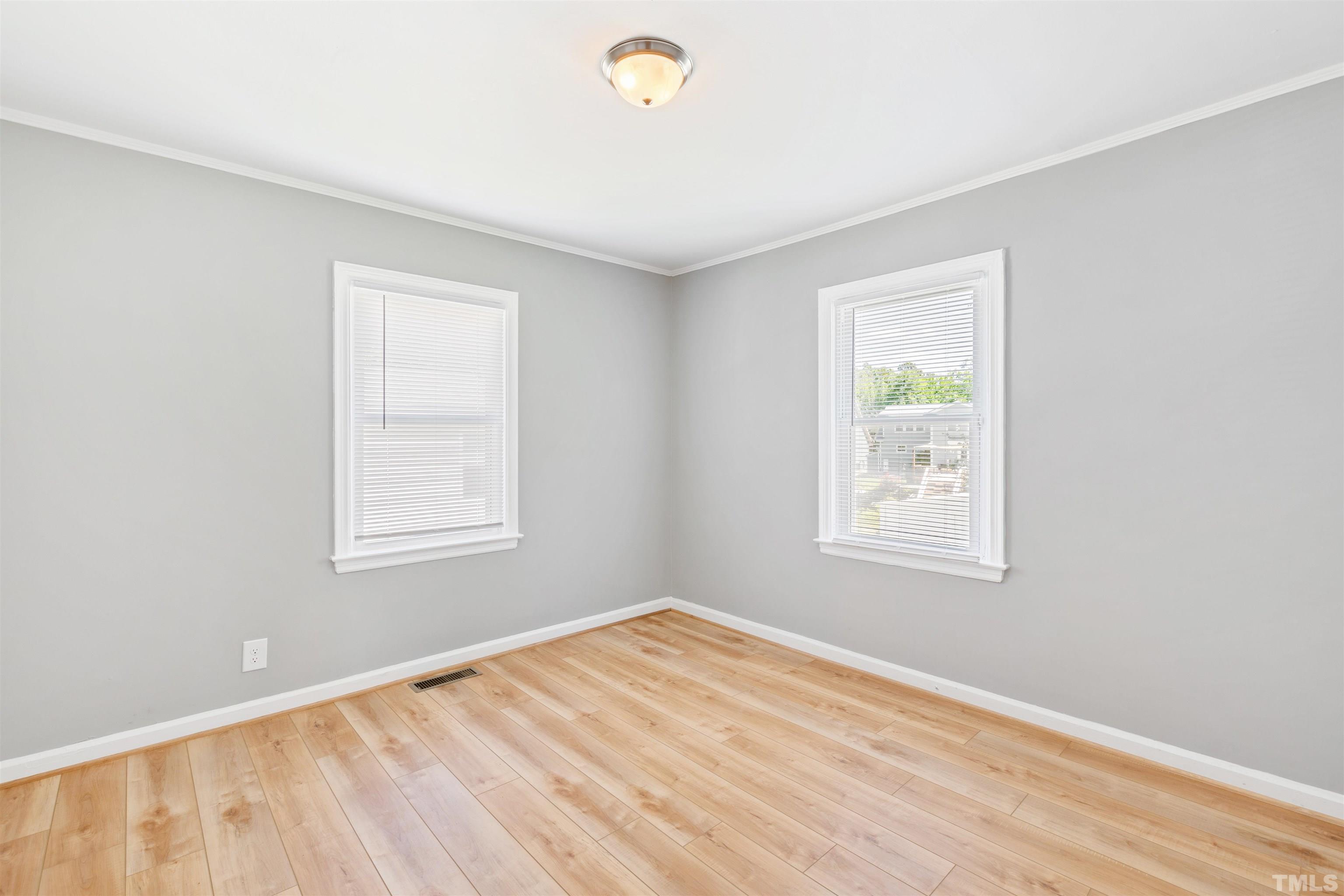 207 Baggett Avenue Raleigh, NC 27604 - Photo 8 of 27 an empty room with a window