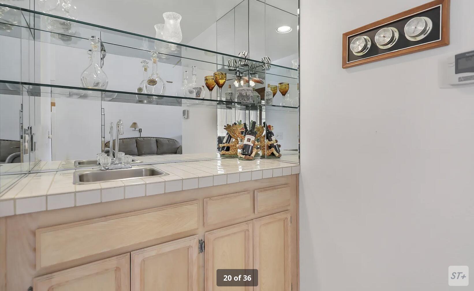 141 Lakeshore Drive Rancho Mirage, CA 92270 - Photo 15 of 34 a bathroom with a sink and a mirror