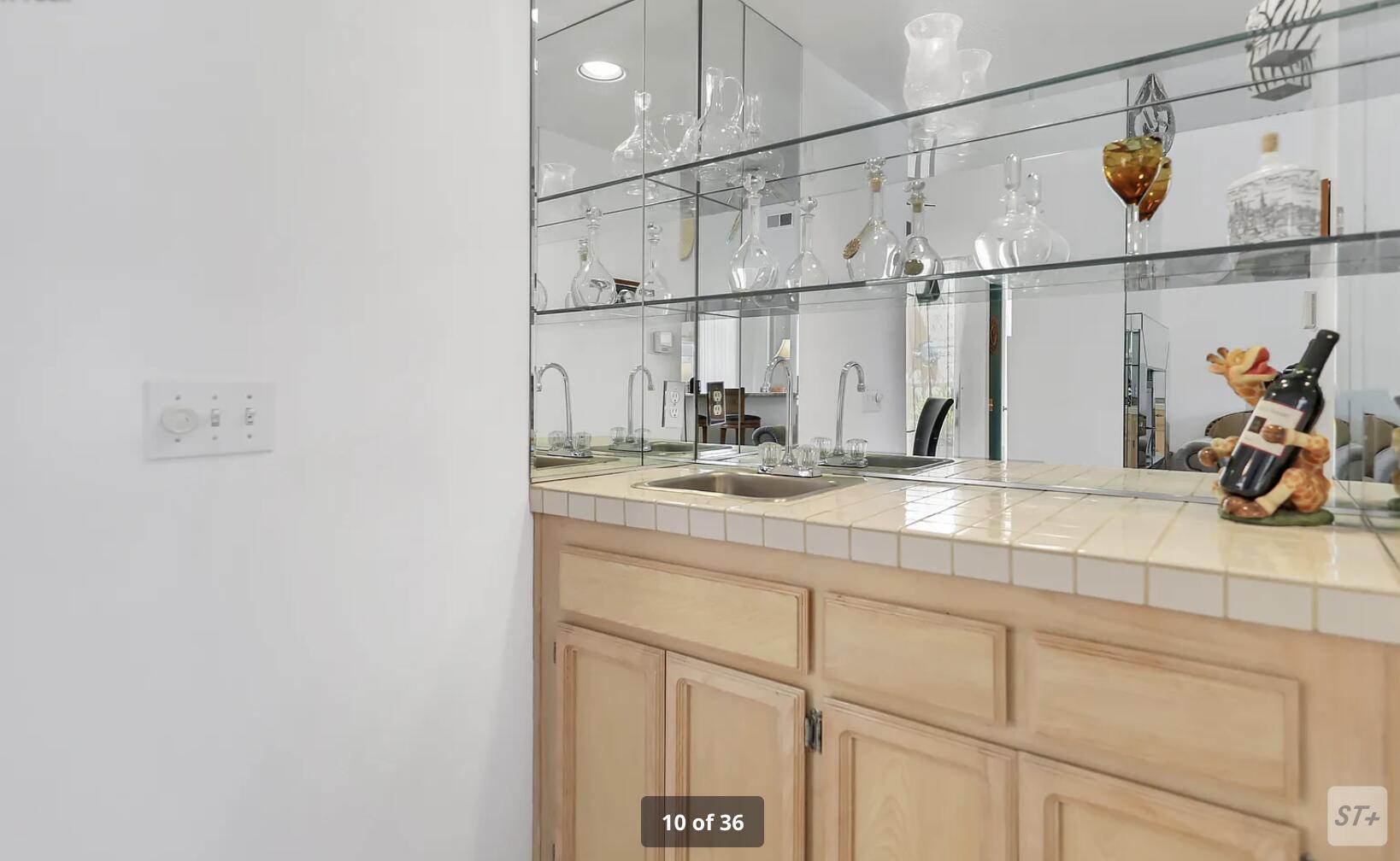 141 Lakeshore Drive Rancho Mirage, CA 92270 - Photo 17 of 34 a bathroom with a sink and a mirror