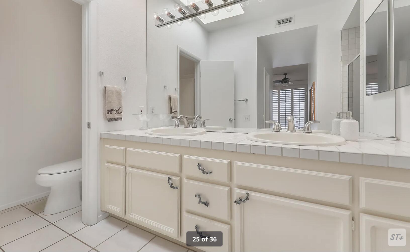 141 Lakeshore Drive Rancho Mirage, CA 92270 - Photo 24 of 34 a bathroom with a sink toilet and mirror