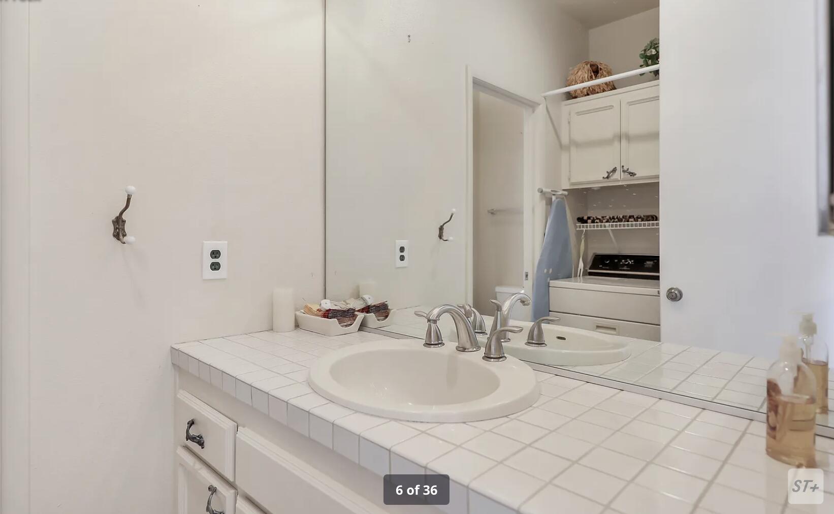 141 Lakeshore Drive Rancho Mirage, CA 92270 - Photo 28 of 34 a bathroom with a sink and a mirror