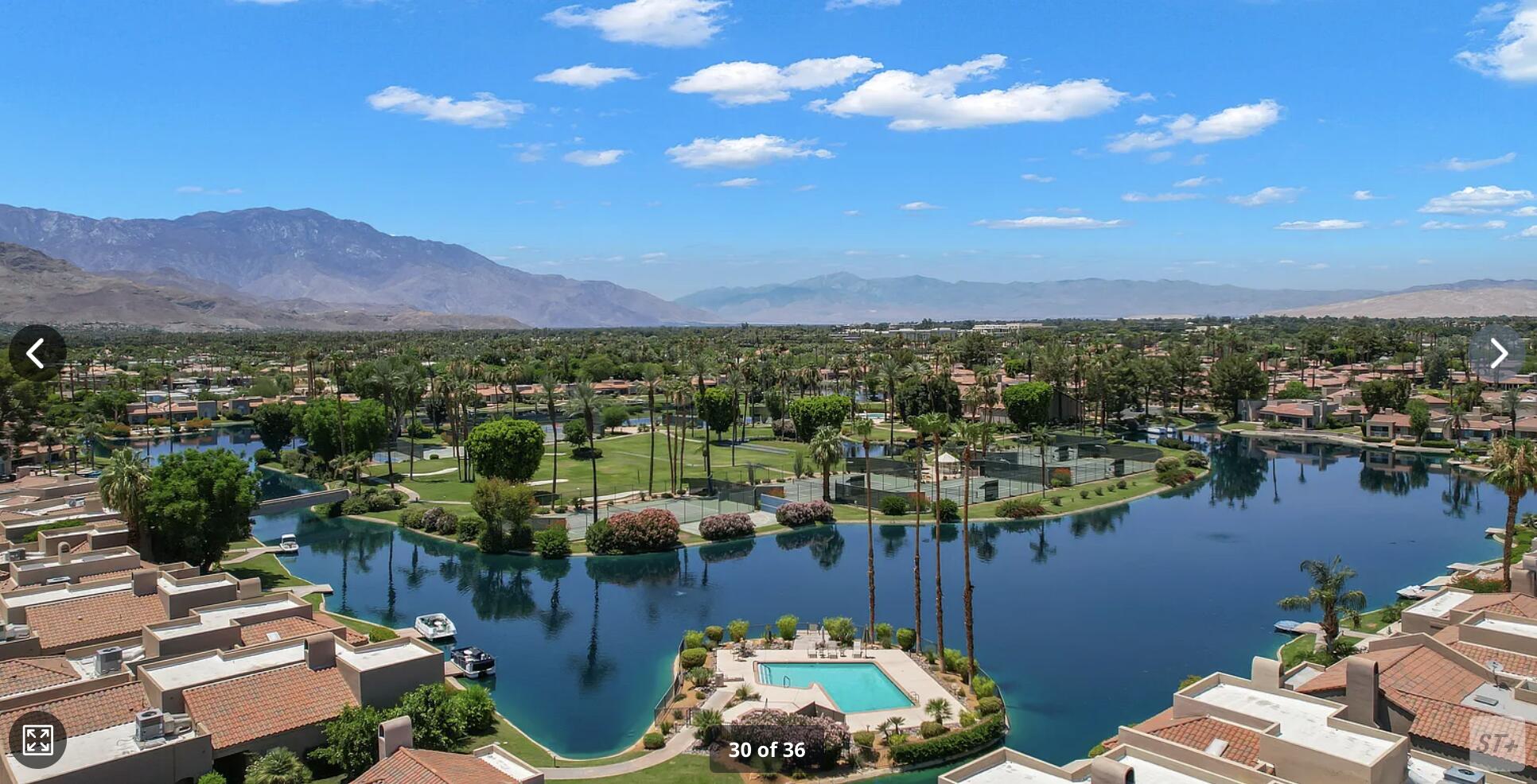 141 Lakeshore Drive Rancho Mirage, CA 92270 - Photo 29 of 34 a view of a lake with a mountain