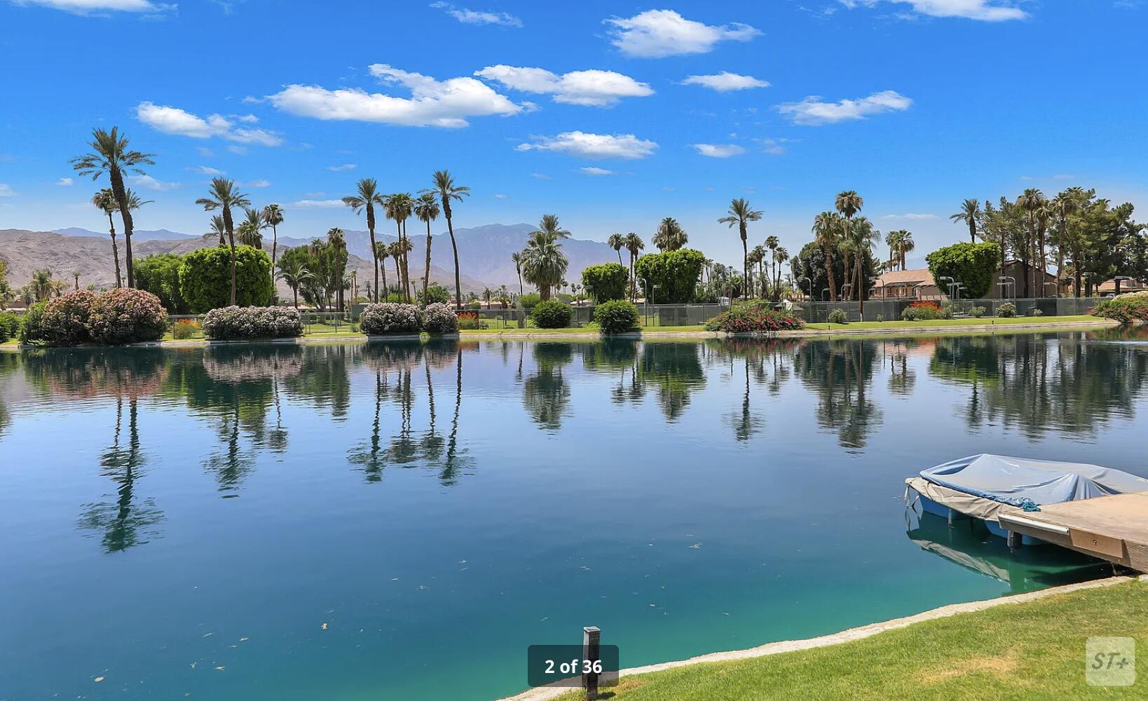 141 Lakeshore Drive Rancho Mirage, CA 92270 - Photo 3 of 34 a view of a lake with houses