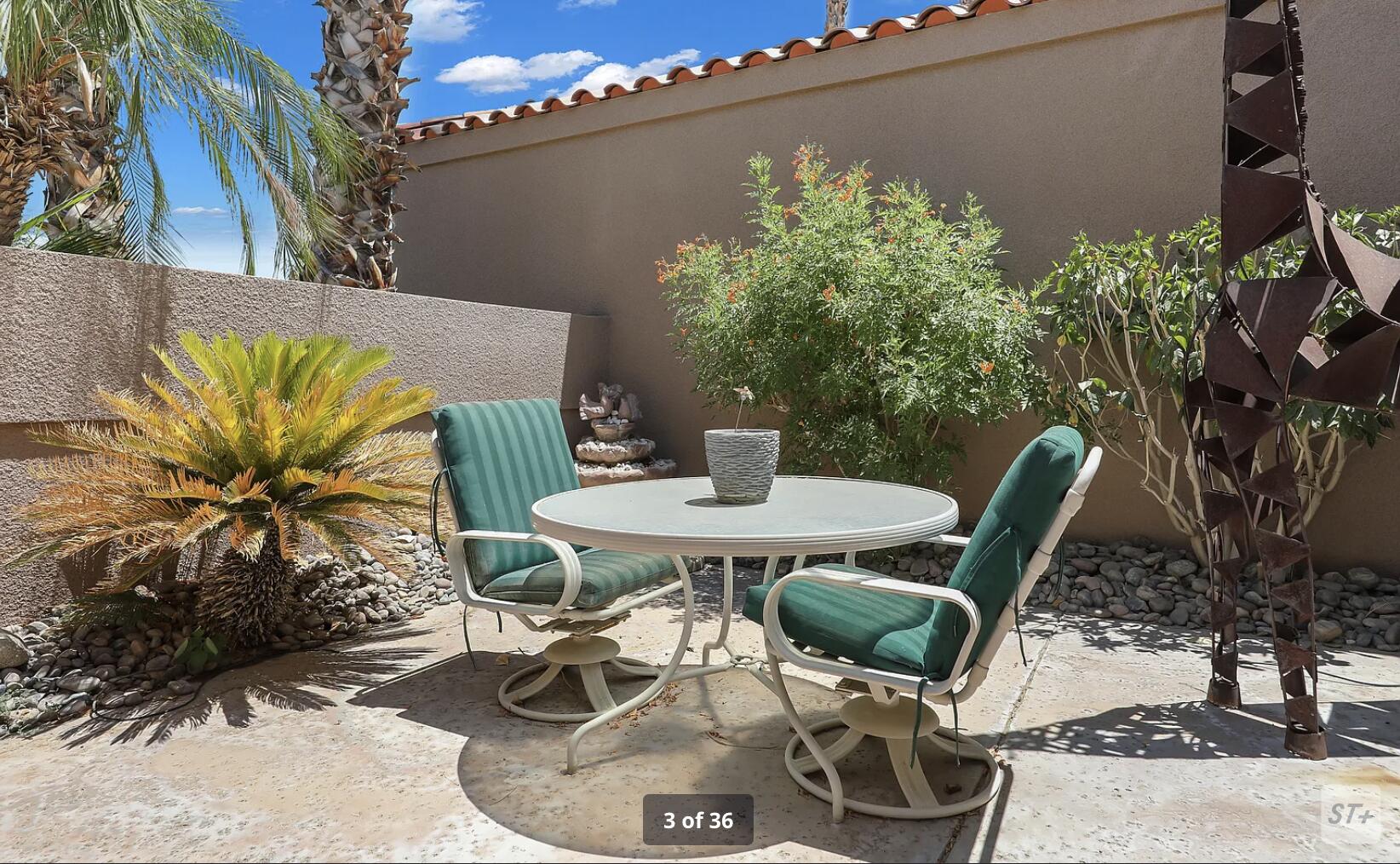 141 Lakeshore Drive Rancho Mirage, CA 92270 - Photo 7 of 34 a patio with a table and chairs