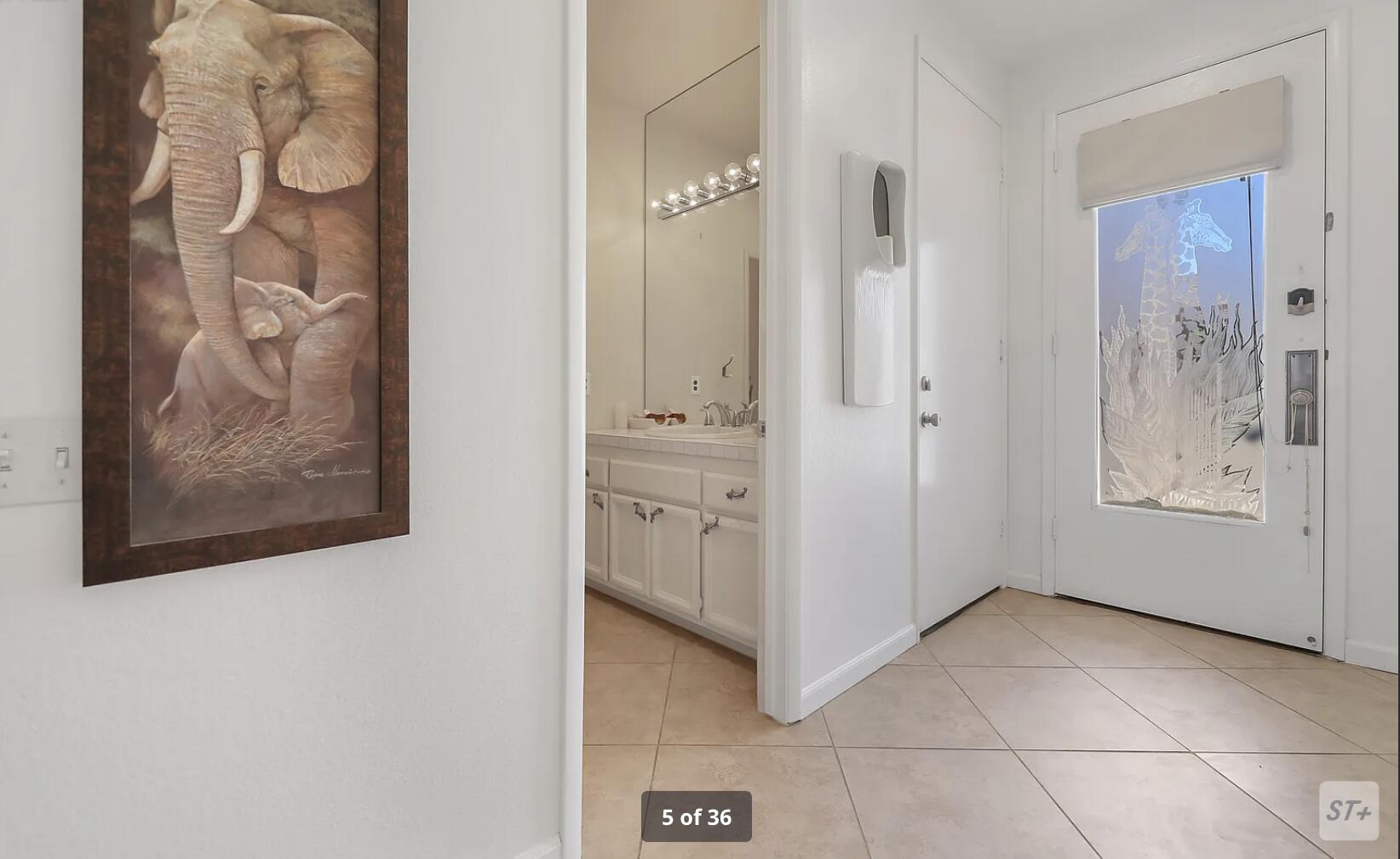 141 Lakeshore Drive Rancho Mirage, CA 92270 - Photo 8 of 34 a view of a hallway with entryway door