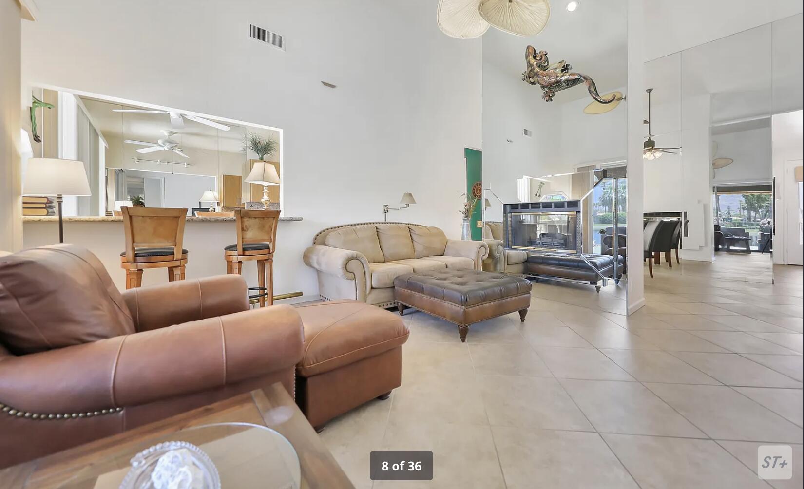 141 Lakeshore Drive Rancho Mirage, CA 92270 - Photo 10 of 34 a living room with furniture and a fireplace