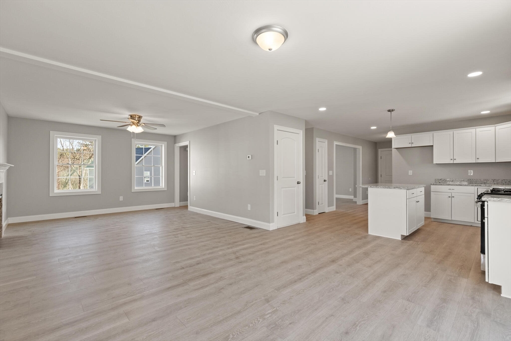 14 R Pne Hl Way, Unit 14 Harvard, MA 01451 - Photo 18 of 41 a view of an empty room with window and wooden floor