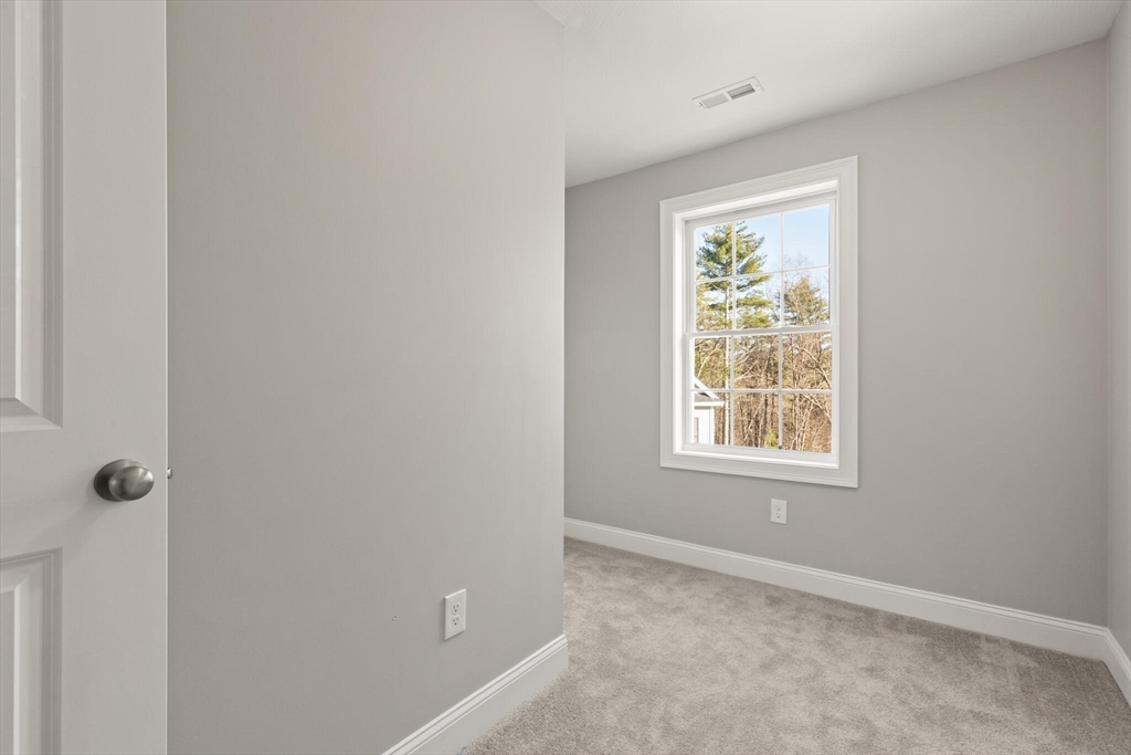 14 R Pne Hl Way, Unit 14 Harvard, MA 01451 - Photo 21 of 41 an empty room with windows