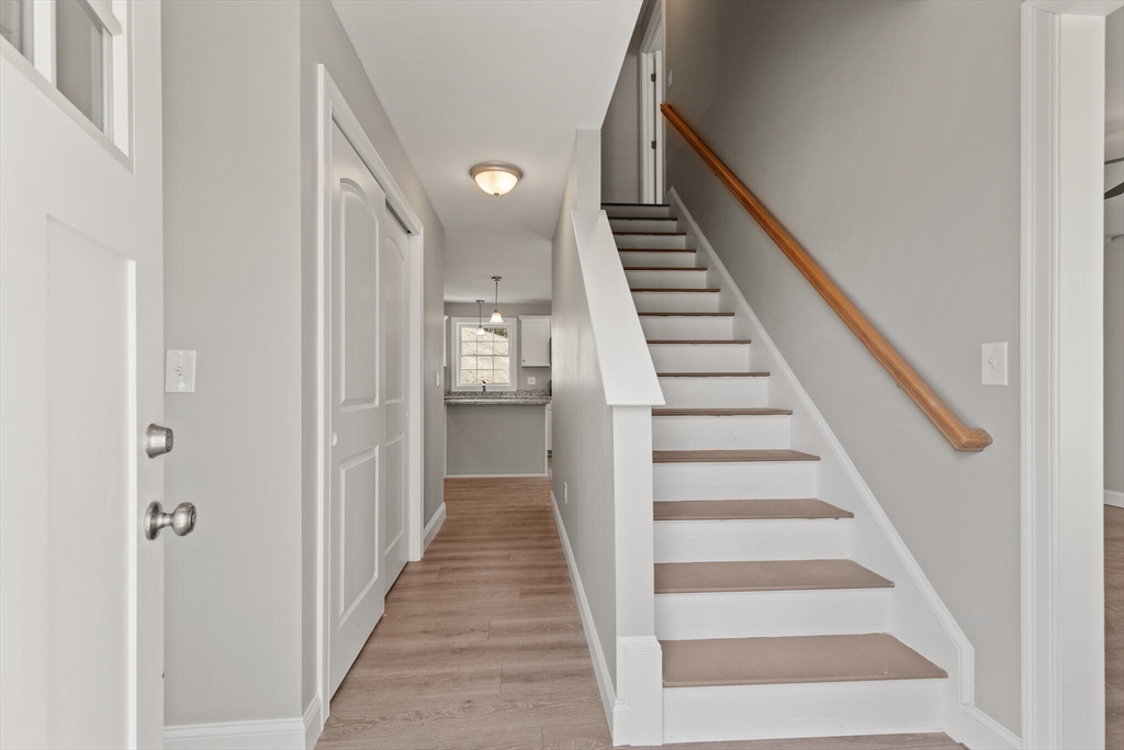 14 R Pne Hl Way, Unit 14 Harvard, MA 01451 - Photo 4 of 41 a view of a hallway with wooden floor and entryway