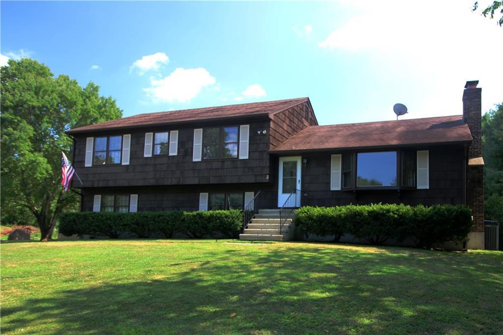 a front view of a house with a yard