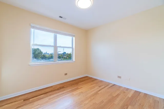 a view of a livingroom with wooden floor
