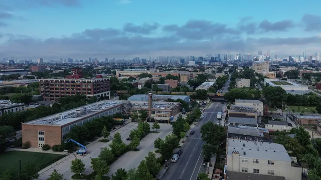 an aerial view of a house with yard