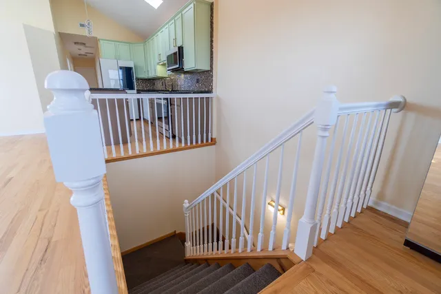 a view of empty room with a fireplace and a flat screen tv