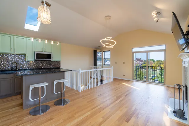 a view of a hallway with a kitchen