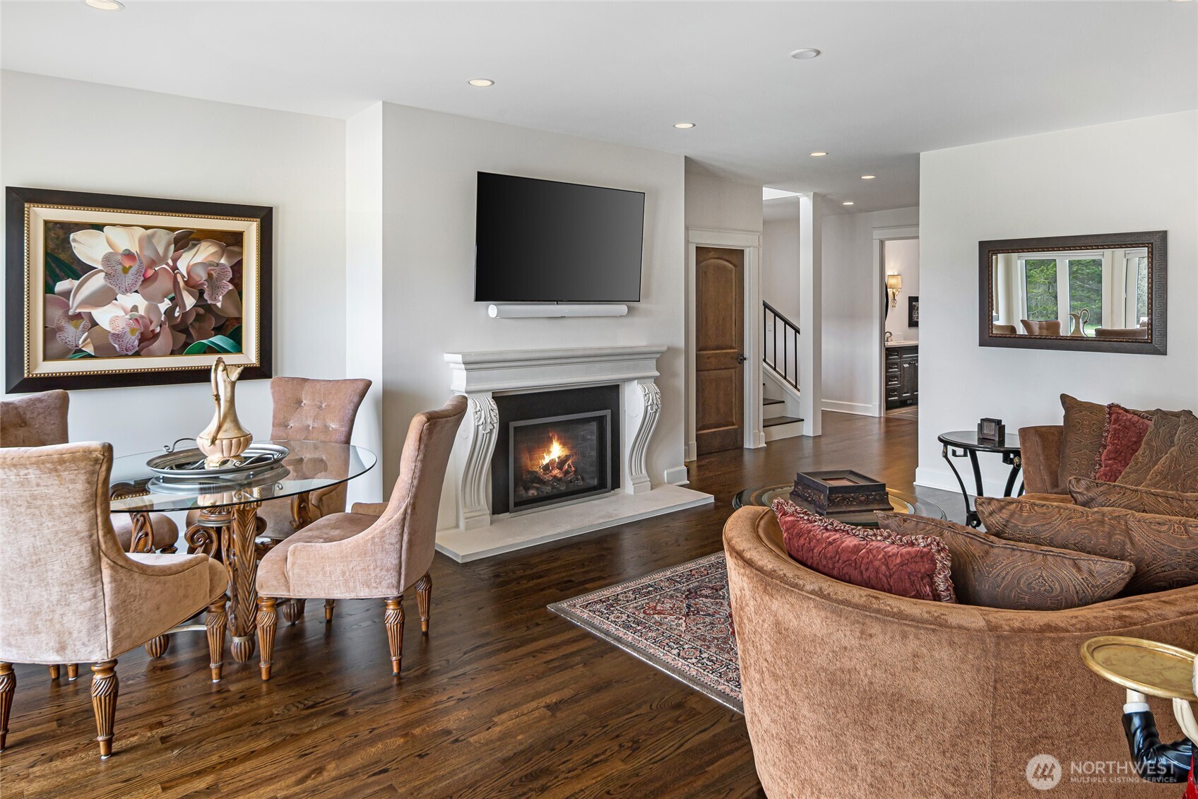 735 Rosler Road San Juan Island, WA 98250 - Photo 18 of 40 a living room with furniture a flat screen tv and a fireplace