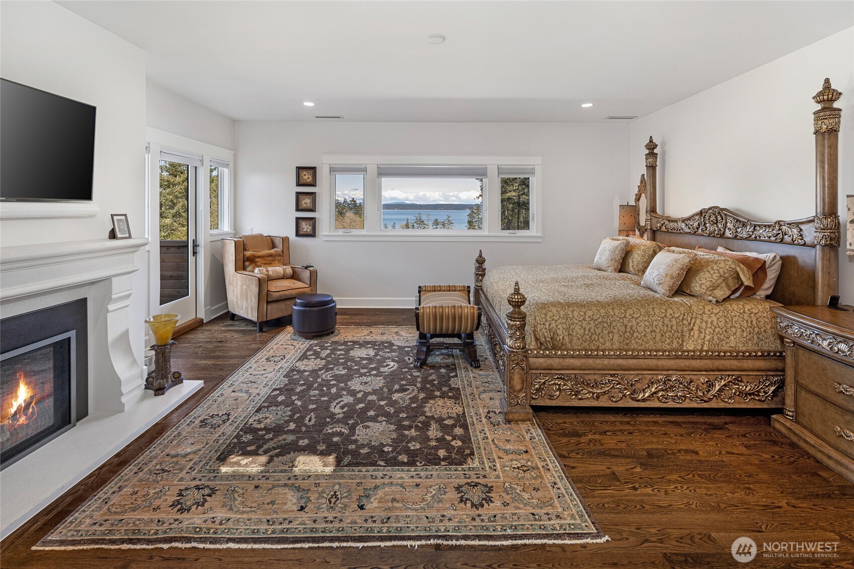 735 Rosler Road San Juan Island, WA 98250 - Photo 22 of 40 a living room with furniture and a flat screen tv
