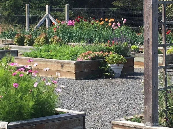 a view of a house with a yard and sitting area