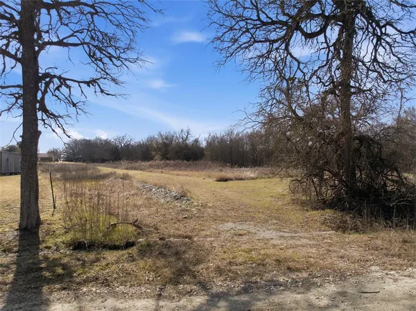 a view of lake with green space