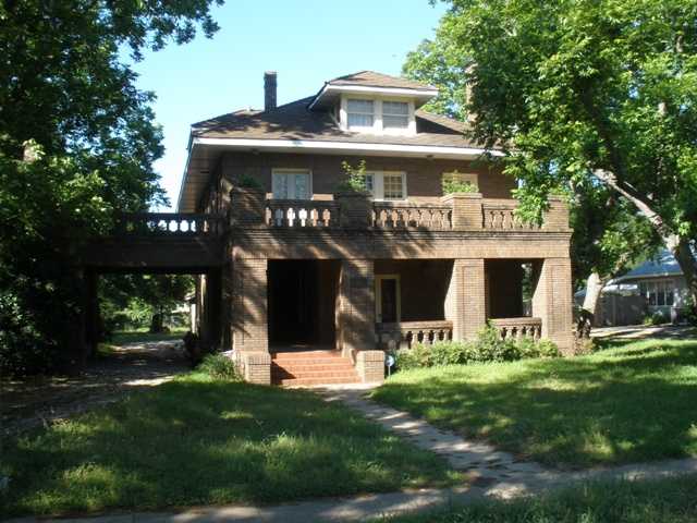 704 North Main Street Elgin, TX 78621 - Photo 1 of 1 a front view of a house with a yard
