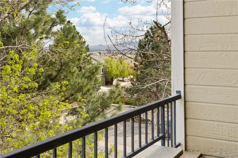 a view of a balcony with wooden floor
