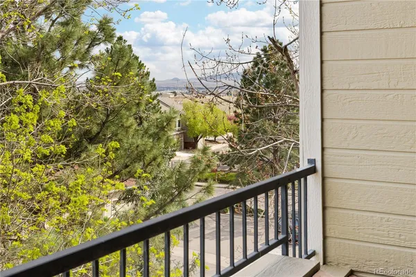a view of a balcony with wooden floor