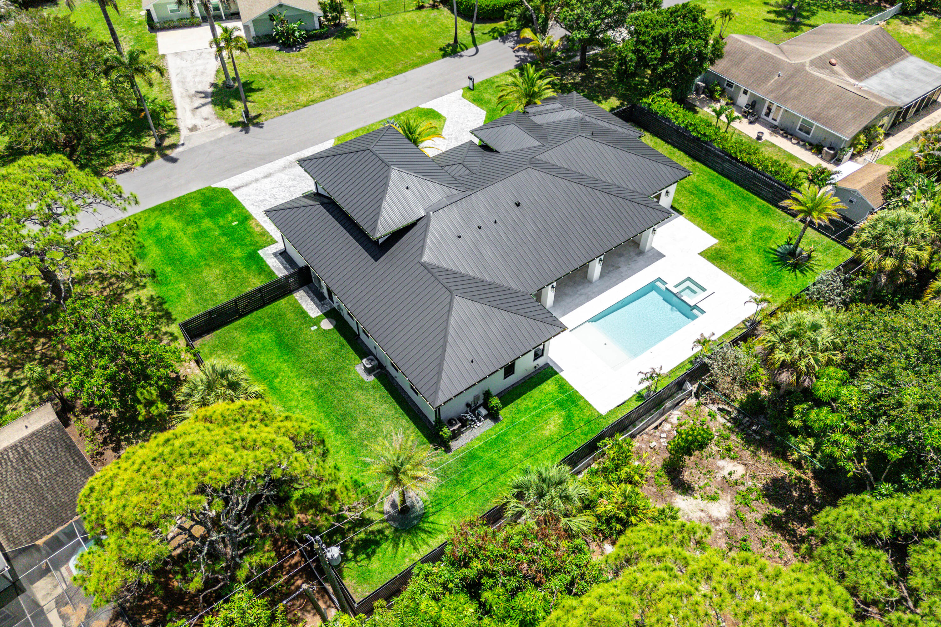 5701 Old Orange Road Jupiter, FL 33458 - Photo 42 of 46 an aerial view of a house with a garden
