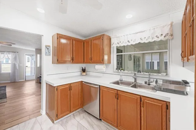 a kitchen with a sink and cabinets