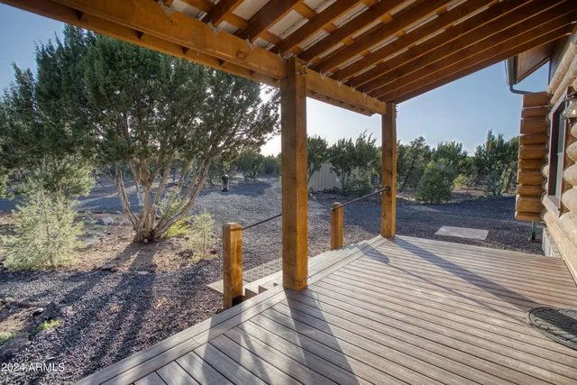 a view of a porch with wooden floor