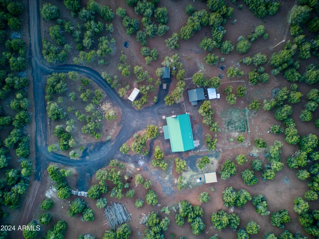 a view of a house with a yard and garage