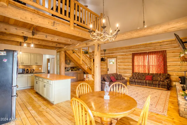 a living room with furniture fireplace and flat screen tv