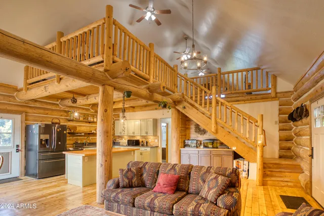 a view of a kitchen with a sink and cabinets