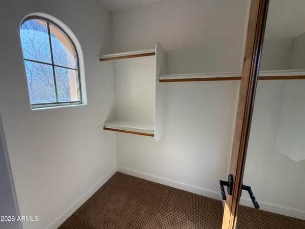 a view of front door with wooden floor