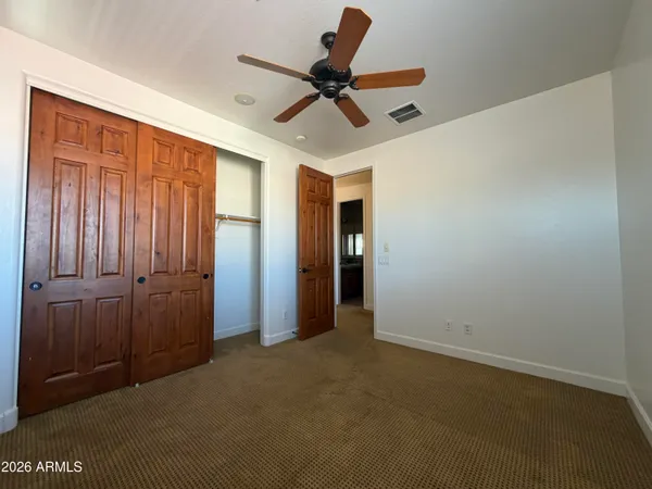 a view of a livingroom with a ceiling fan
