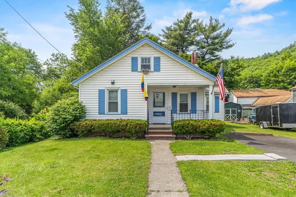 a front view of a house with a yard