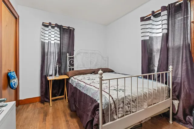 a bedroom with a bed and a table