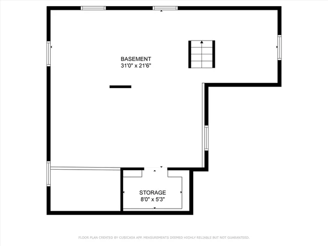 a picture of a bench in front of a wall