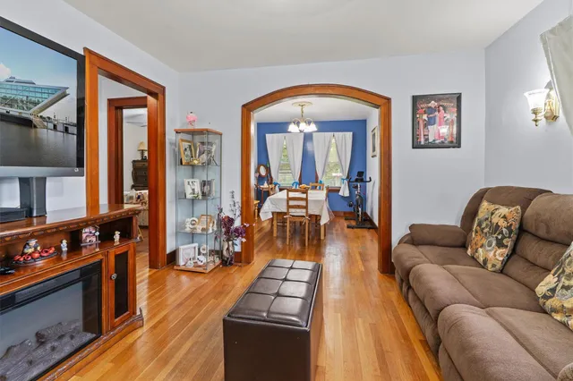 a living room with furniture fireplace and flat screen tv