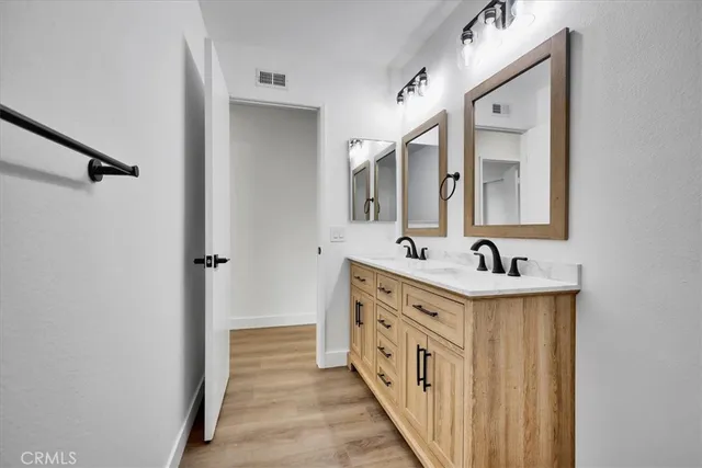 an empty room with a window and a ceiling fan