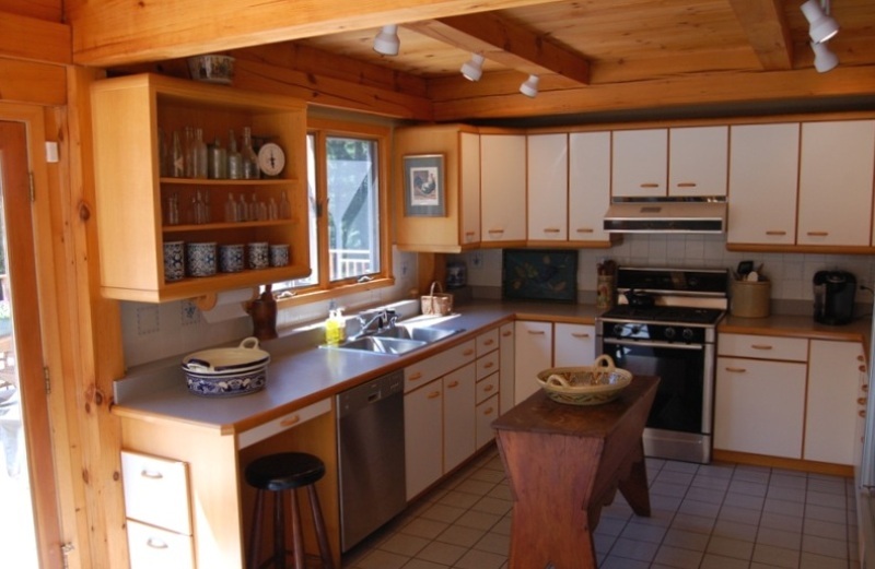 147 Reservoir Road Lenox, MA 01240 - Photo 14 of 31 a kitchen with stainless steel appliances granite countertop a stove and a microwave