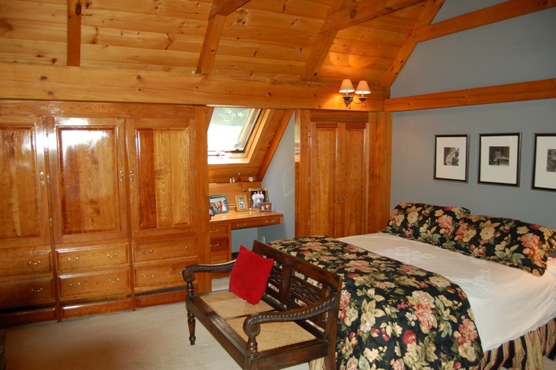 147 Reservoir Road Lenox, MA 01240 - Photo 3 of 31 a bedroom with a bed and a dresser with mirror
