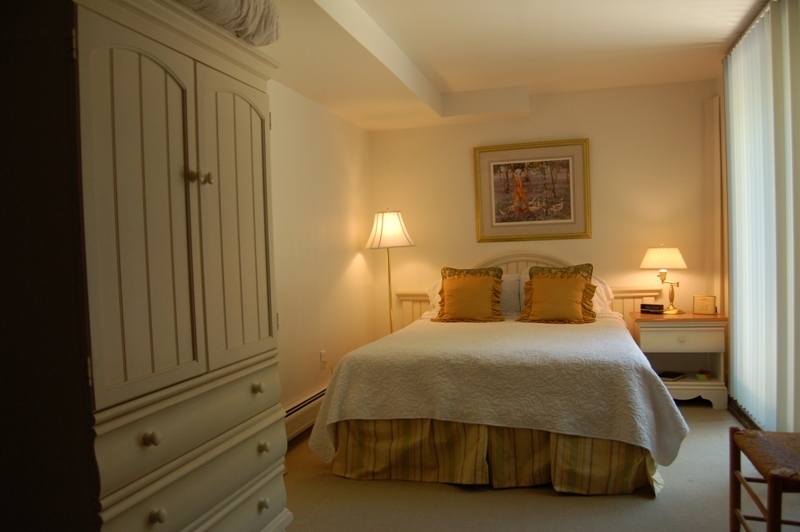 147 Reservoir Road Lenox, MA 01240 - Photo 6 of 31 a bedroom with a bed and night stand
